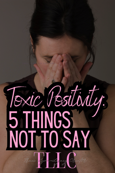 Woman with her head in her hands. Toxic Positivity: 5 Things Not to say